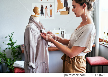 Fashion, design and woman with mannequin, focus and working at creative small business boutique. Designer, creativity and tailor with dress on doll for clothes and eco friendly textile startup studio Fashion, design and woman with mannequin, focus and working at creative small business boutique. Designer, creativity and tailor with dress on doll for clothes and eco friendly textile startup studio 135174626