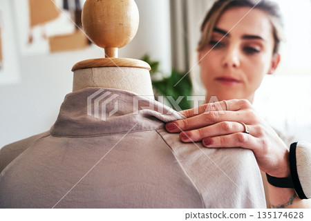 Fashion, hand of woman and tailor with mannequin, focus and creative small business boutique. Closeup, creativity and designer sewing dress on doll for clothes, working in studio or textile start up. Fashion, hand of woman and tailor with mannequin, focus and creative small business boutique. Closeup, creativity and designer sewing dress on doll for clothes, working in studio or textile start up. 135174628