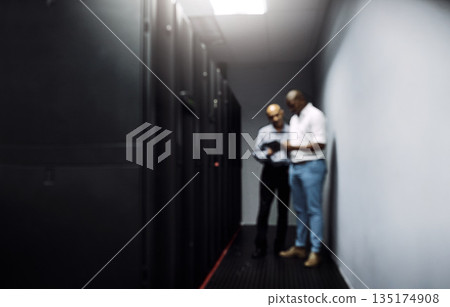 Server room, men or blurry technicians on technology together for cybersecurity glitch with teamwork. Coding IT support code, collaboration or African engineers fixing network for information tablet 135174908