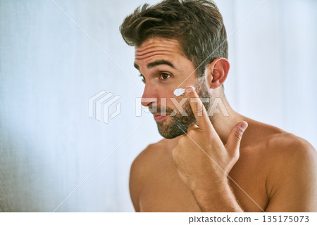 Man, face and cream for skincare, beauty and sunscreen at home with mockup for morning routine, grooming and self care. Young guy, lotion and facial cosmetics for dermatology, clean skin and hygiene 135175073