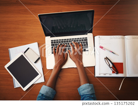 Woman hands, online typing and laptop with education and learning notes at home. Top, female person and computer working with studying, student notebook and writing in a house doing web research Woman hands, online typing and laptop with education and learning notes at home. Top, female person and computer working with studying, student notebook and writing in a house doing web research 135175202