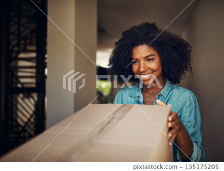 African woman, front door and package for delivery, e commerce and shipping service with happiness at house. Girl, box and smile for supply chain, customer experience and cargo for mail at apartment 135175205