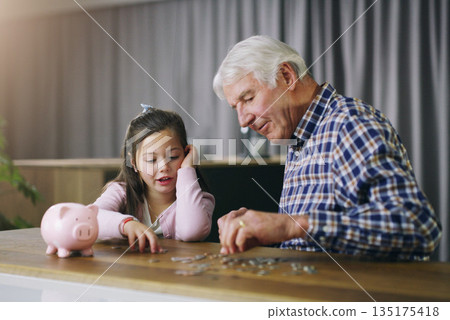 Money, piggy bank and help with child and grandfather for savings, investment and learning. Growth, cash and future with young girl and old man in family home for generations, finance and support Money, piggy bank and help with child and grandfather for savings, investment and learning. Growth, cash and future with young girl and old man in family home for generations, finance and support 135175418