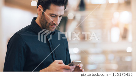 Business man, texting and phone with space in office mockup for networking, chat and email communication. Businessman, smartphone and focus for schedule, notes and social network app in workplace 135175435