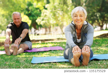 Portrait, fitness and senior couple in a park, yoga and meditation for wellness, workout and healthy lifestyle. Face, mature woman or old man outdoor, stretching and exercise for balance or fresh air 135175529