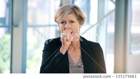 Portrait, infection and a business woman coughing in her office at work while looking sick with a virus. Health, covid and cough with a senior female manager or CEO standing alone in the workplace Portrait, infection and a business woman coughing in her office at work while looking sick with a virus. Health, covid and cough with a senior female manager or CEO standing alone in the workplace 135175661