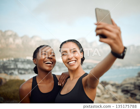 Fitness friends laugh in selfie at beach, women workout together with happiness and active life outdoor. Exercise in nature, healthy and happy with female people training and smile in picture or post 135175788