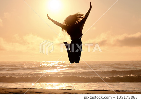 Freedom, jump and sunset with woman at beach for travel, celebration and winner. Success, summer and silhouette with person jumping in nature for inspiration, energy and purpose with mockup space Freedom, jump and sunset with woman at beach for travel, celebration and winner. Success, summer and silhouette with person jumping in nature for inspiration, energy and purpose with mockup space 135175865