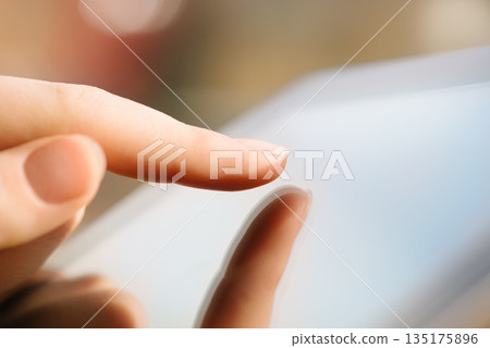 Hand, woman and touching tablet, screen and responsive technology for typing online with an app, network or social media. Hands, touchscreen and reading news, blog or search on internet website 135175896