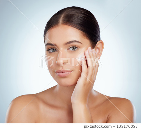 Skincare, face and beauty of woman with lotion in studio isolated on a white background. Portrait, dermatology cream and female model apply cosmetics, sunscreen or moisturizer product for skin health 135176055