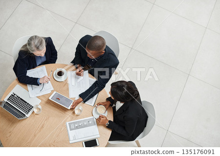 Top view, staff and employees brainstorming, collaboration and planning with technology, documents and discussion. Business people, group and coworkers share ideas, website launch and online reading 135176091