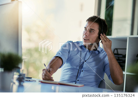 Callcenter agent, smile and notes, man consulting with advice, sales information and help desk. Phone call, conversation and customer support consultant writing in notebook while speaking in office. Callcenter agent, smile and notes, man consulting with advice, sales information and help desk. Phone call, conversation and customer support consultant writing in notebook while speaking in office. 135176324