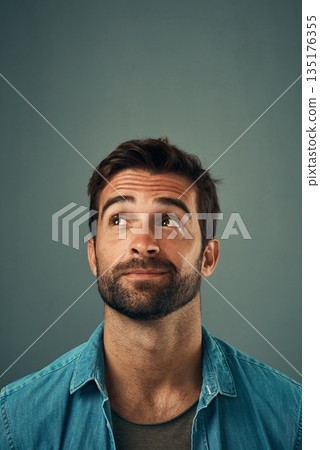 Man, face and thinking on mockup space for idea, plan or wondering against a grey studio background. Isolated thoughtful male person or model in question, doubt or confused mindset for planning dream 135176355