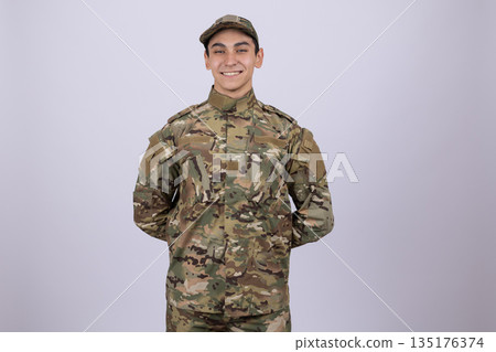 Smiling young soldier in military uniform 135176374