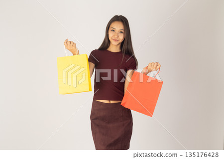 Woman with bags in purple dress Woman with bags in purple dress 135176428