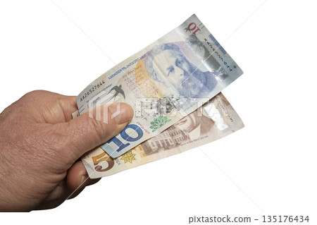 Georgian Lari banknotes in a man's hand 135176434