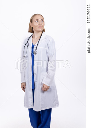 Female doctor in white coat with stethoscope Female doctor in white coat with stethoscope 135176611