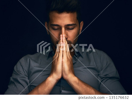 Night, worship and man with hands praying in studio to God, Jesus Christ or spiritual healing on black background. Holy, gratitude and thank you by christian male in prayer for help, hope and trust Night, worship and man with hands praying in studio to God, Jesus Christ or spiritual healing on black background. Holy, gratitude and thank you by christian male in prayer for help, hope and trust 135176632