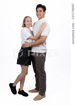 Couple standing close and smiling at each other 135176697