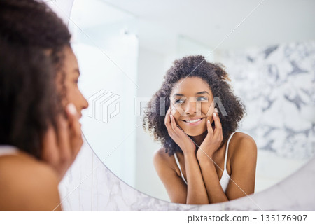 Woman, skin and mirror in the bathroom with glow in the morning for facial treatment at home. Model, skincare and beauty with smile for self care with dermatology, reflection and happiness at home. 135176907