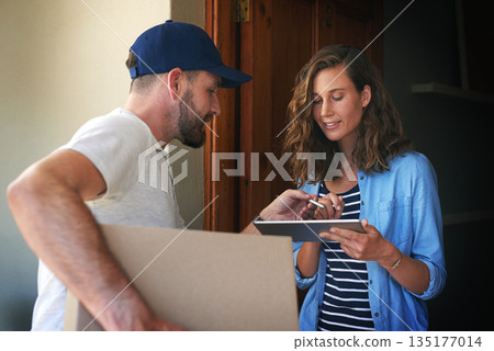 Woman, delivery man and box with tablet to sign for order, parcel or cargo package in transport service. Female person receiving shipment from male courier, supply chain or ecommerce purchase at home 135177014