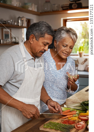 Vegetables, cooking and old couple with wine in kitchen, healthy food and marriage time together in home for dinner. Drink, glass and senior woman with man, meal prep and wellness diet in retirement. Vegetables, cooking and old couple with wine in kitchen, healthy food and marriage time together in home for dinner. Drink, glass and senior woman with man, meal prep and wellness diet in retirement. 135177121