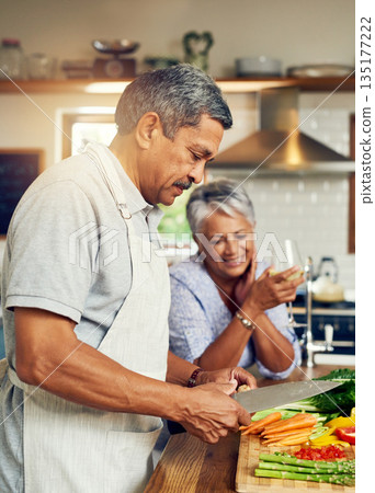 Cooking, old man and happy woman with wine at kitchen counter, healthy food and marriage bonding in home. Drink, glass and vegetables, senior couple with happiness vegetable meal prep and retirement. Cooking, old man and happy woman with wine at kitchen counter, healthy food and marriage bonding in home. Drink, glass and vegetables, senior couple with happiness vegetable meal prep and retirement. 135177222
