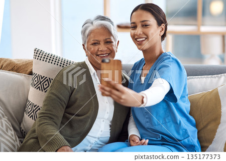 Caregiver, selfie or old woman in nursing home with smile or happiness for profile pictures or retirement. Women, photography or happy nurse relaxing or smiling with elderly patient for wellness 135177373