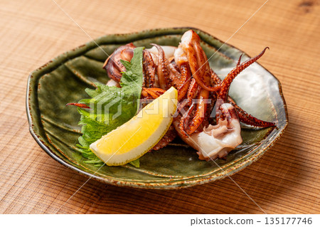 Grilled Tentacles: A classic Japanese dish at an izakaya, grilled to perfection 135177746