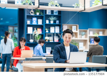 Middle-class engineer working in an office Middle-class engineer working in an office 135177984