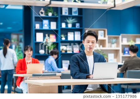 Middle-class engineer working in an office 135177986