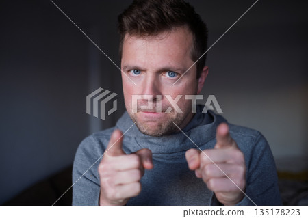 Displeased male boss pointing finger, blaming or warning the viewer. Displeased male boss pointing finger, blaming or warning the viewer. 135178223