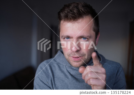 Displeased male boss pointing finger, blaming or warning the viewer. Displeased male boss pointing finger, blaming or warning the viewer. 135178224