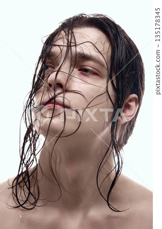 Close up male face with wet hair and natural skin texture. Close up male face with wet hair and natural skin texture. 135178345