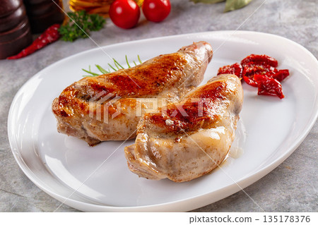 Roasted rabbit leg served rosemary Roasted rabbit leg served rosemary 135178376