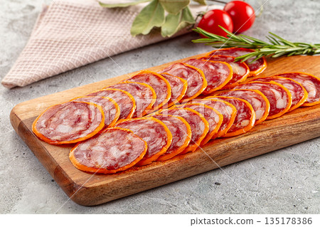 Spicy salami sausage in the cheese Spicy salami sausage in the cheese 135178386