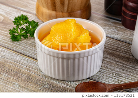Golden Ghee melted homemade butter 135178521