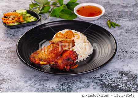 Spicy roasted chicken wing with rice Spicy roasted chicken wing with rice 135178542
