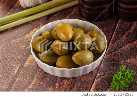 Greek green olives marinated in the bowl Greek green olives marinated in the bowl 135178555