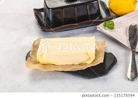 Dairy butter piece over board 135178594