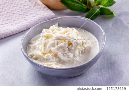 Italian soft young stracciatella cheese 135178639