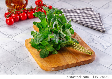 Heap of green fresh mint stems Heap of green fresh mint stems 135178660