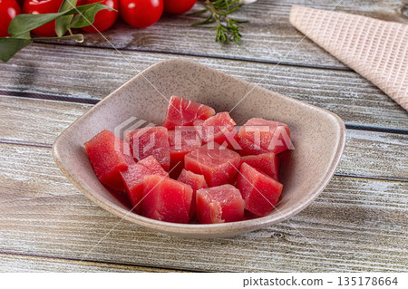 Raw tuna fish cubes heap 135178664