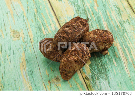 Brown topinambur roots for cooking 135178703