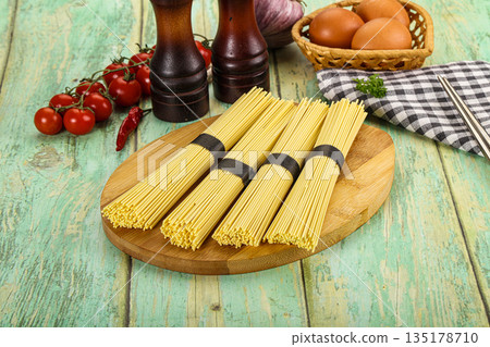 Raw dry uncooked egg noodles 135178710