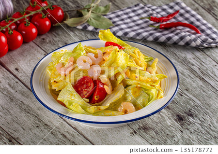 Caesar salad with prawn and parmesan 135178772