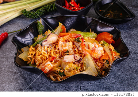 Asian noodles with seafood and vegetables Asian noodles with seafood and vegetables 135178855