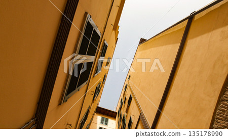 A view of a roofs from the narrow alley - yellow buildings A view of a roofs from the narrow alley - yellow buildings 135178990