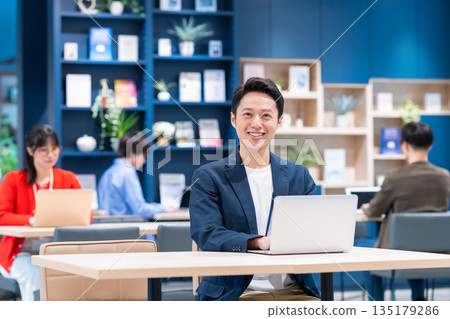 Middle-class engineer working in an office 135179286