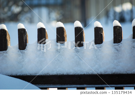 Fresh snow on the fence Fresh snow on the fence 135179434